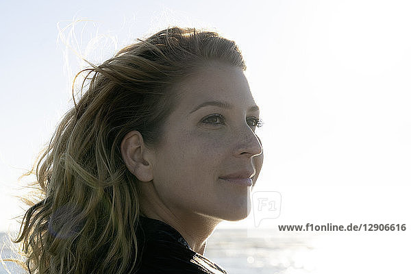 Portrait of a beautiful woman in summer at the sea