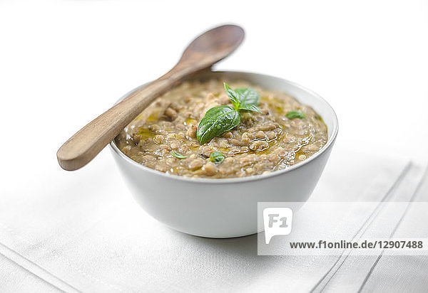 Barley soup with olive oil and basil