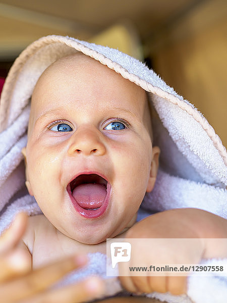 Portrait of baby girl with mouth wide open