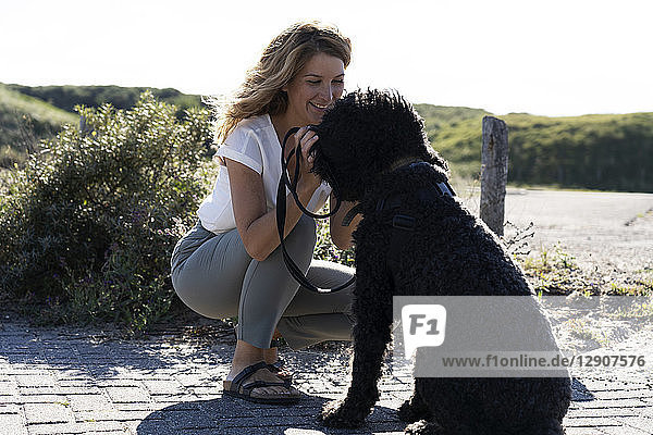 Woman petting her dog