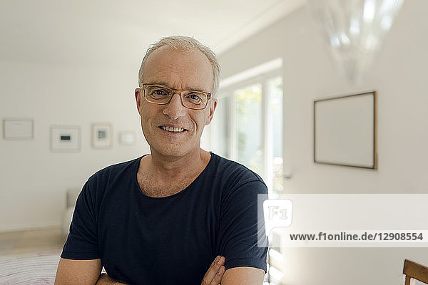 Portrait of a smiling mature man at home