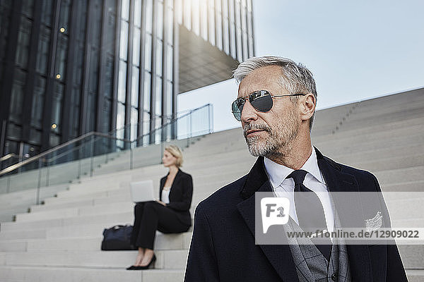 Portrait of fashionable mature businessman wearing sunglasses