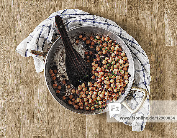 Cooking pot of chickpeas and beans with rosemary