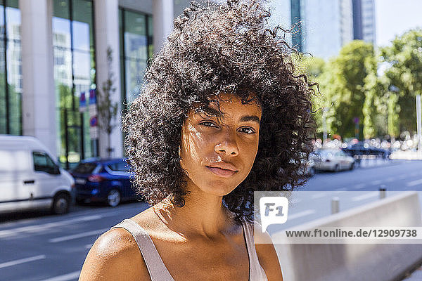 Germany  Frankfurt  portrait of young woman with curly hair