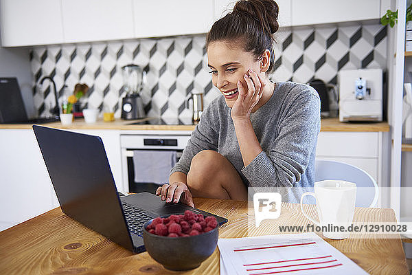 Young woman working from home  using laptop