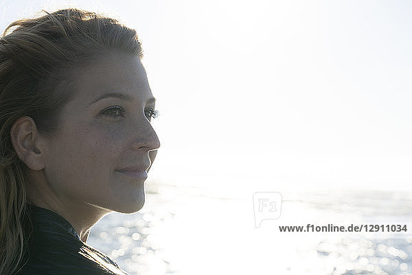 Portrait of a beautiful woman in summer at the sea