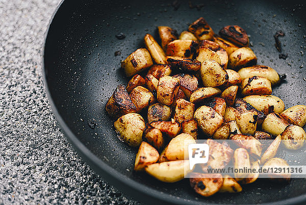 Fried potatoes with smoked paprika in pan