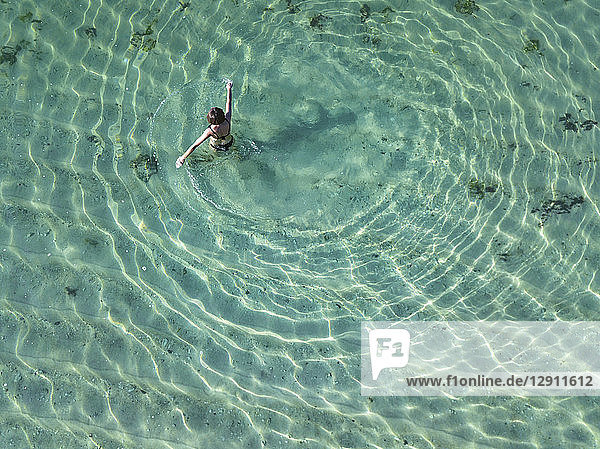 Indonesia  Bali  Melasti  Aerial view of Karma Kandara beach  one woman in water