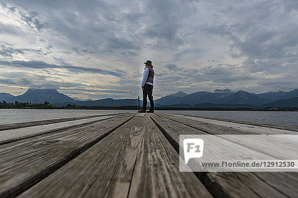 Germany  Bavaria  Allgaeu  Lake Hopfensee  woman standing on jetty