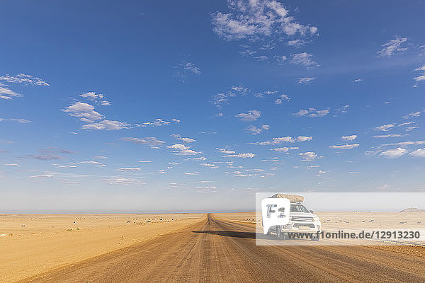 Africa  Namibia  Namib desert  Naukluft National Park  off-road vehicle on gravel road