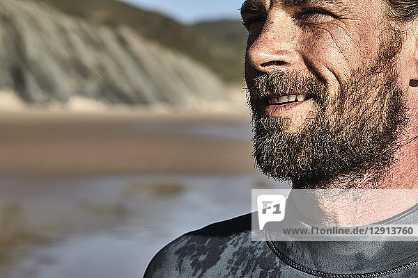Portugal  Algarve  portrait of confident surfer on the beach