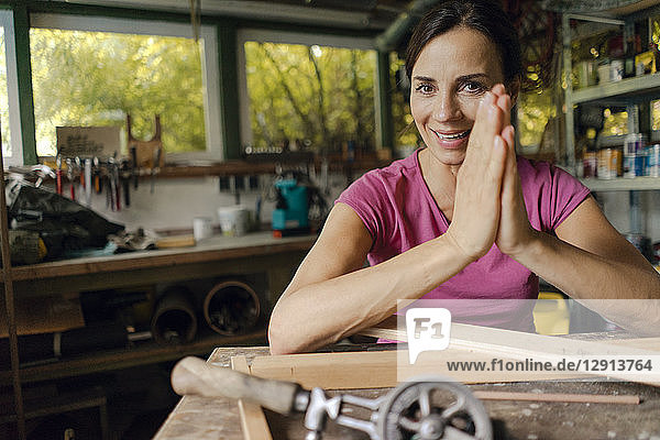 Portrait of a smiling mature woman in her workshop