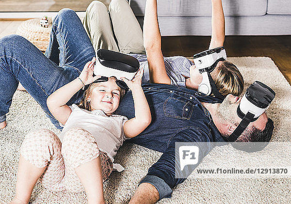 Family using VR goggles at home