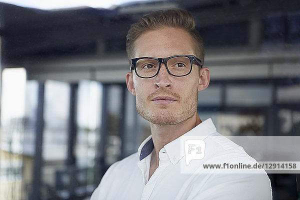 Portrait of confident businessman wearing glasses