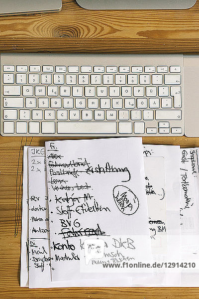 To-do list next to computer keyboard