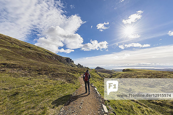 UK  Scotland  Inner Hebrides  Isle of Skye  Trotternish  Quiraing  tourist on hiking trail