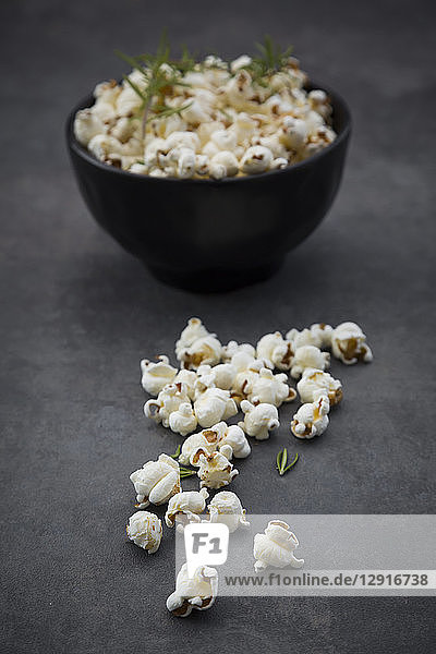 Bowl of popcorn with parmesan and rosemary