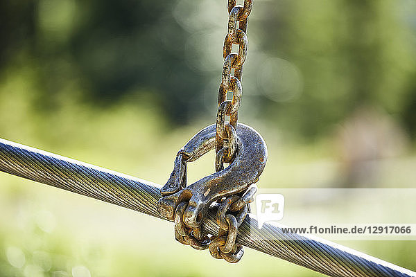 Crane hook lifting up steel rope