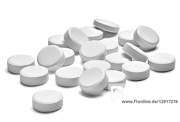 White pills on white background  close-up