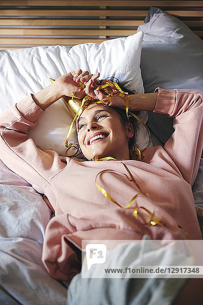 Woman resting after birthday party on bed