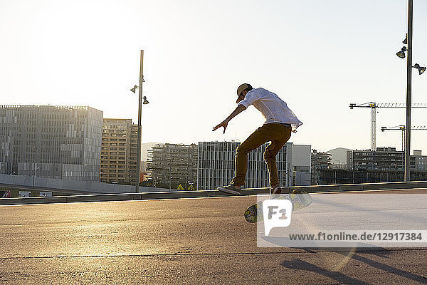 Young man riding skateboard in the city