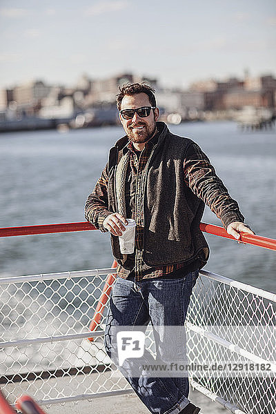 Portrait of bearded man wearing sunglasses riding ferry to Peaks Island  Portland  Maine  USA