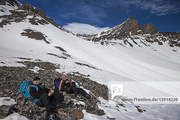Mountaineers resting before the final approach to Donaldson Peak in the Lost River Mountain Range  Idaho  USA