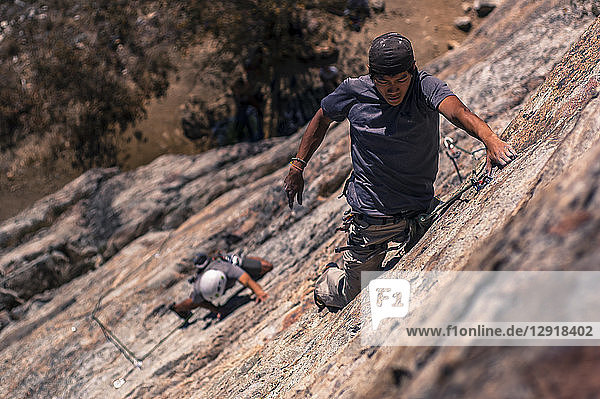 View from above of two men rock climbing inÂ Skaha Bluffs Provincial Park  Penticton  British Columbia  Canada