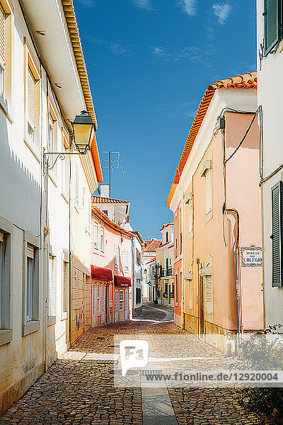 A narrow cobblestone street in the historic centre of Cascais Portugal Europe