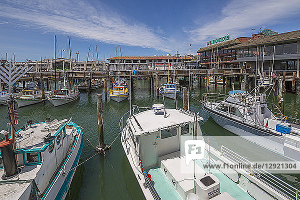 Boats and restaurants in Fishermans Wharf harbour San Francisco California United States of America North America