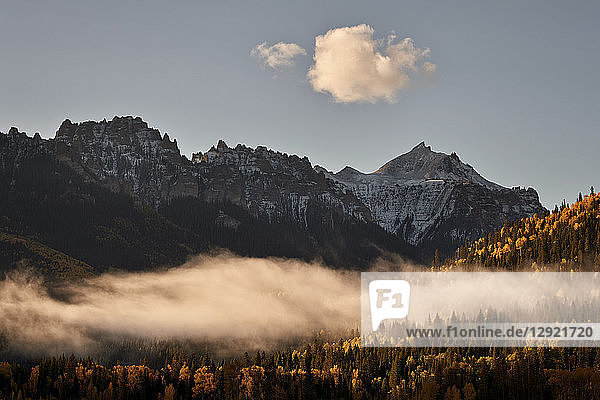 Snow-covered mountain in the fall with fog  Uncompahgre National Forest  Colorado  United States of America  North America