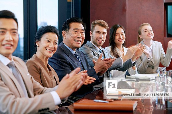 Business men and women in a meeting