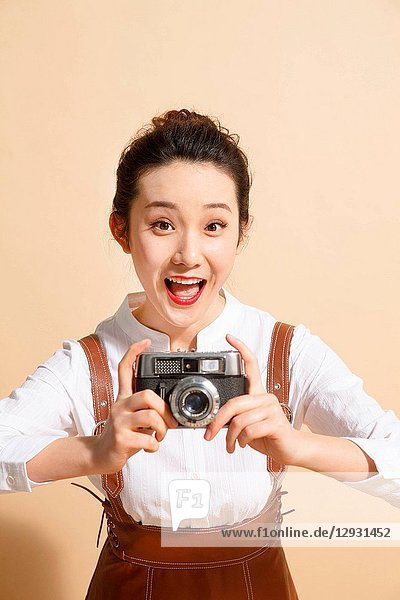 Young woman with the camera