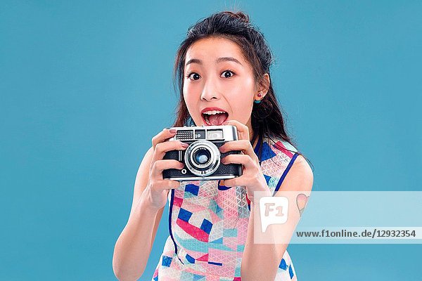 Young woman with a camera