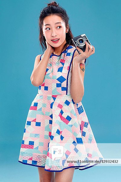 Young woman with a camera