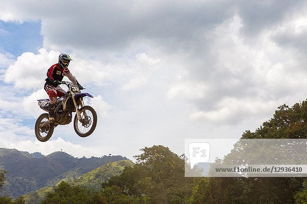 Motocross Driver jumping in a race. Colombia. South America.