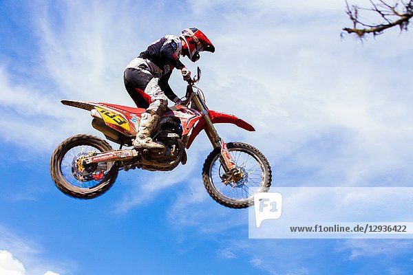 . Motocross Driver jumping in a race. Colombia. South America.