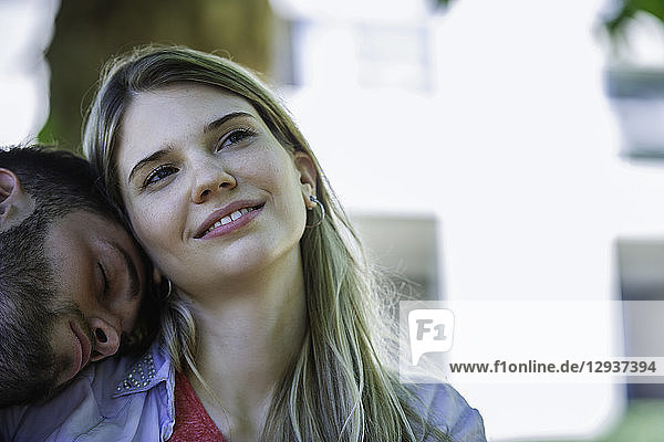 Man relaxing on the woman's shoulder
