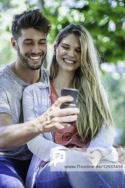 Close-up of couple taking selfie with smartphone