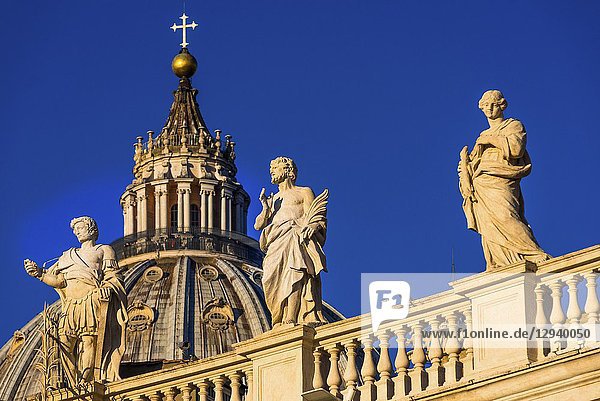St Peter's Cathedral Cupola and religious statues on St Peter's square  Vatican city  Rome  Lazio  Italy.