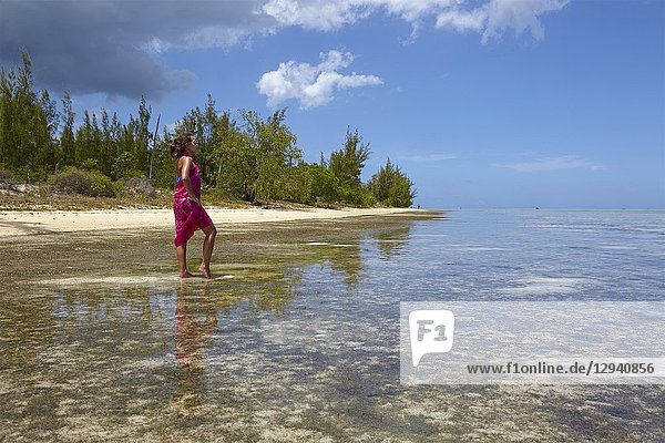 Girl on the beach of Ile aux Benitiers  Mauritius.