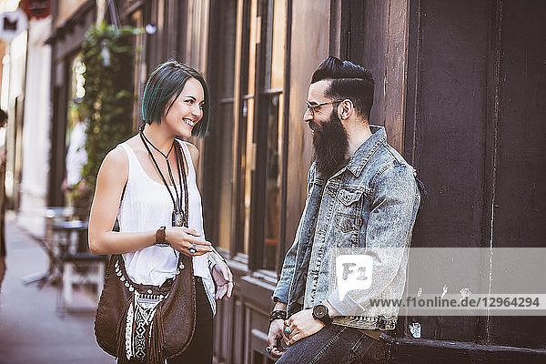 Young hipster couple in full discussion