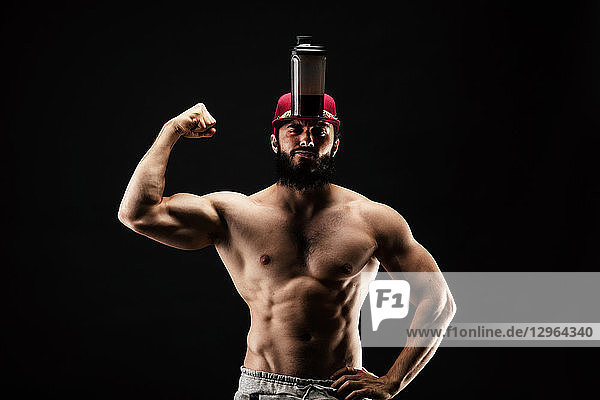 bodybuilder with a shaker on his cap