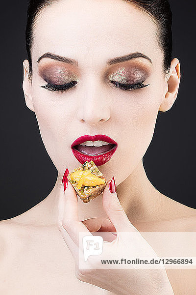 Tight shot of a girl enjoying a lemon cake