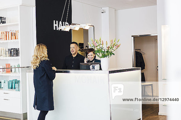 Client at counter of hairdresser in Sweden