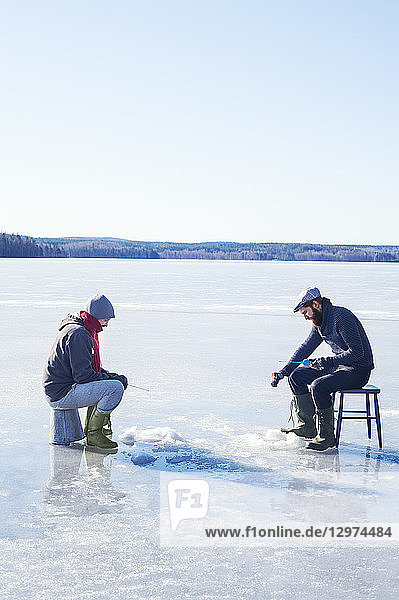 Fishing on a frozen lake in Dalarna  Sweden