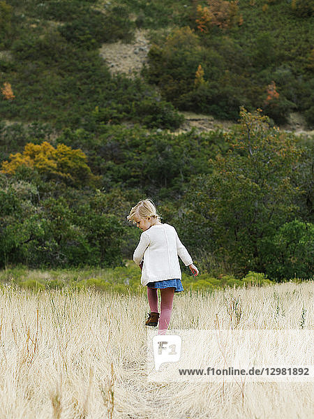 Girl walking in field