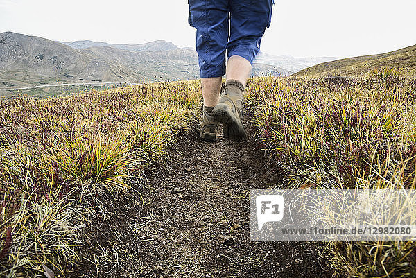 Legs of woman hiking Loveland Pass in Colorado