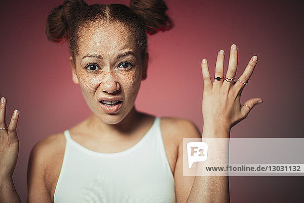 Portrait frustrated young woman gesturing