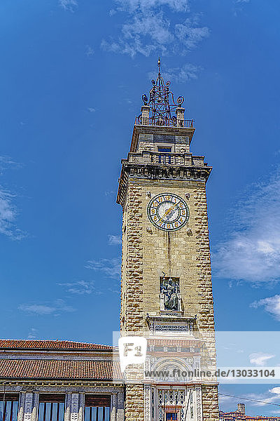 Day view of Torre dei Caduti with clock  1924 historic stone Tower of The Fallen  at Piazza Vittorio Veneto  Bergamo  Lombardy  Italy